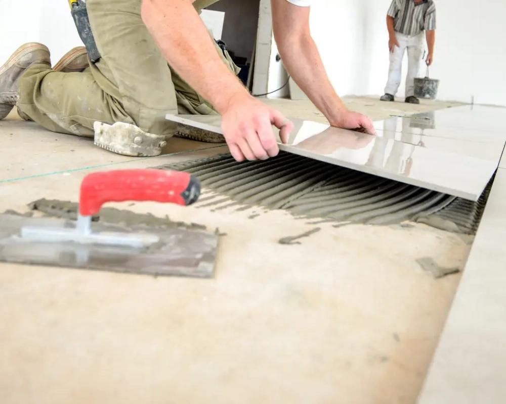 Professional skilled worker in work clothes, on the ground, selective focus, extreme little depth of field, lot of copy space, low angle view